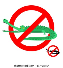 Stop crocodile. Prohibited alligator. Strikethrough caiman. Emblem against predator reptile. Red prohibition sign. Ban wild aggressive amphibian