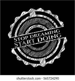 Stop dreaming start doing written on a blackboard