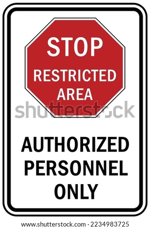 Stop at gate, Stop sign and labels restricted area authorized personnel only private property under security camera no trespassing employee only