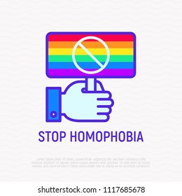 Stop homophobia thin line icon: rainbow flag in hand. Modern vector illustration. 