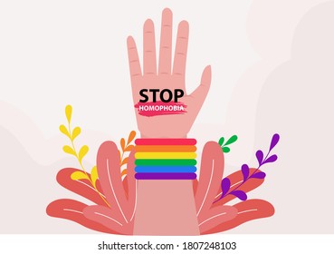 Stop Homophobia vector concept: closeup of arm wearing rainbow armband and Stop Homophobia text written on its palm