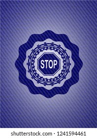 stop icon inside badge with denim texture