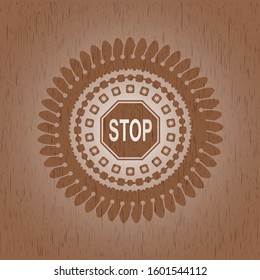 stop icon inside badge with wood background
