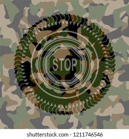 stop icon inside camouflage emblem