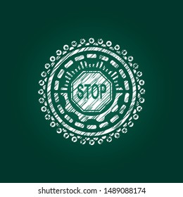 stop icon inside chalk emblem written on a blackboard