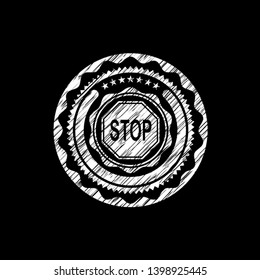stop icon inside chalkboard emblem on black board
