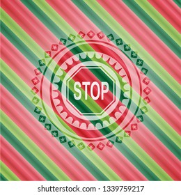 stop icon inside christmas badge.