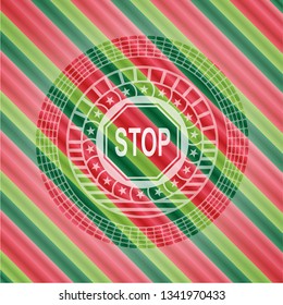 stop icon inside christmas badge.