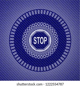 stop icon inside emblem with denim texture