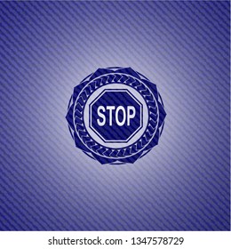 stop icon inside emblem with denim texture