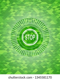 stop icon inside green emblem with triangle mosaic background