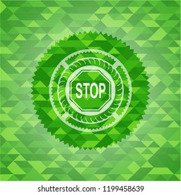 stop icon inside green mosaic emblem