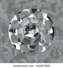 stop icon inside grey camouflage emblem