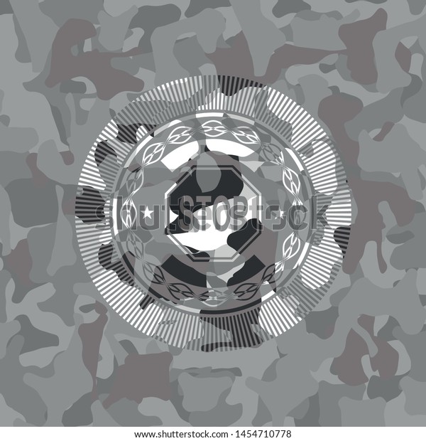 stop icon inside grey\
camouflage emblem