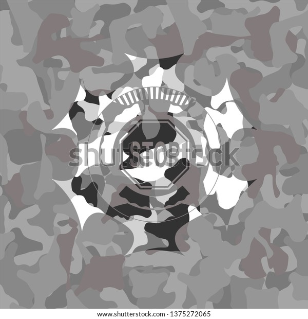 stop icon inside grey\
camouflaged emblem