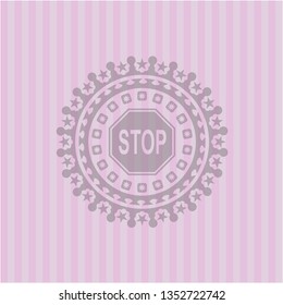 stop icon inside pink emblem