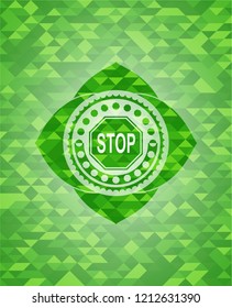 stop icon inside realistic green mosaic emblem