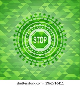 stop icon inside realistic green mosaic emblem