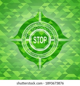 stop icon inside realistic green mosaic emblem. 