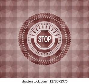 stop icon inside red seamless geometric emblem.