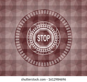 stop icon inside red seamless emblem with geometric pattern.