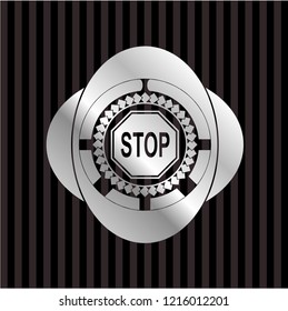 stop icon inside silvery badge or emblem