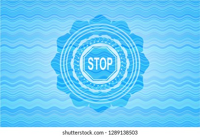 stop icon inside sky blue water wave badge.