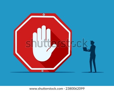 Stop working. Businessman makes decision with stop sign