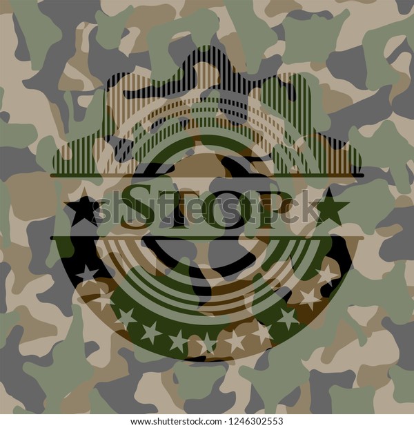 Stop written on a\
camouflage texture