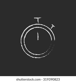 Stopwatch hand drawn in chalk on a blackboard vector white icon isolated on a black background.