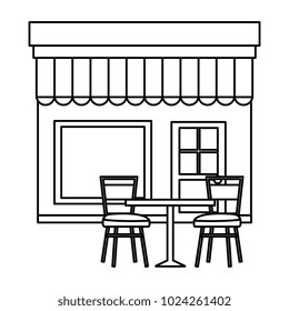 store building front with chairs and table