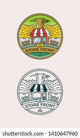 store front below the tree circle logo badge in color and monochrome