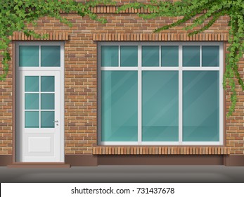 Store Front With Large Transparent Window And Hanging Ivy. Facade Of Red Brick. Empty Glass Showcase Of Boutique. Entrance In The Small  Shop.