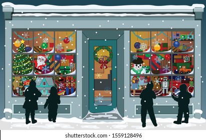 Storefront Christmas window filled with vintage toys, presents and colorful decorations. Silhouettes of children are outside, looking into the windows while snowflakes fall to the snowy sidewalk. 