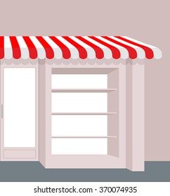 Storefront with striped roof. Red and white stripes of canopy over counter. Element of  building.
