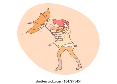 Storm, nature, autumn concept. Young unhappy angry woman cartoon character holding blowing on wind umbrella on street. Autumnal windy bad stormy weather with rain and gusting wind vector illustration.