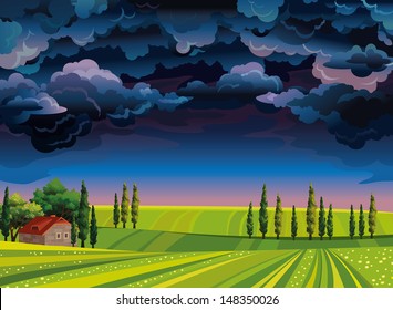 Stormy sky and house on a green meadow.