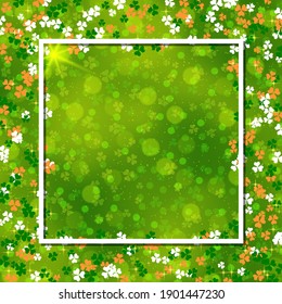 St.Patrick's Day green blurred vector background with clover leaves and white frame