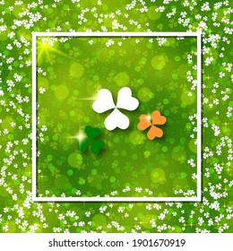 St.Patrick's Day green blurred vector background with clover leaves and white frame