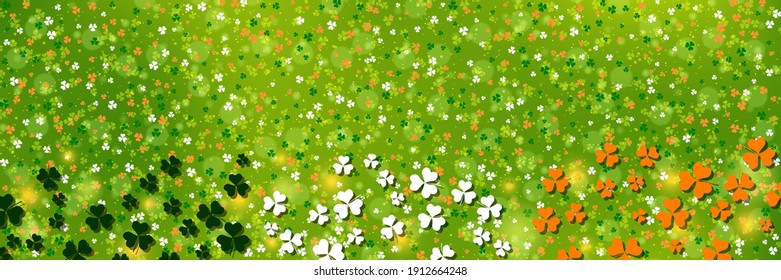 St.Patrick's Day green blurred vector background with colorful clover leaves
