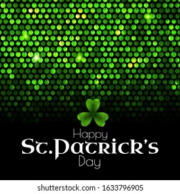 St'Patrick's Day green sequins background with shamrock and light.