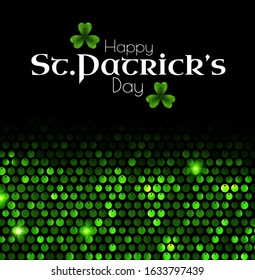 St'Patrick's Day green sequins background with shamrock and light.