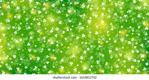 St.Patrick's Day green vector background with clover leaves and bokeh effect