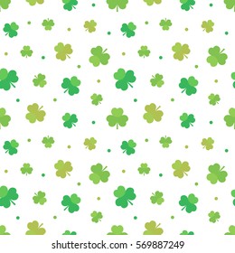 St.Patrick's Day seamless pattern background with green clover, shamrock and dots.