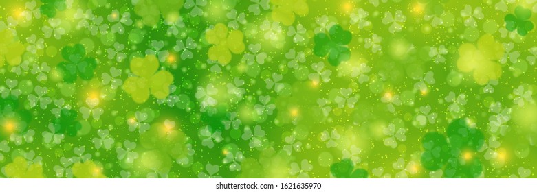 St.Patrick's Day vector banner template. Green blurred background with clover leaves and bokeh effect