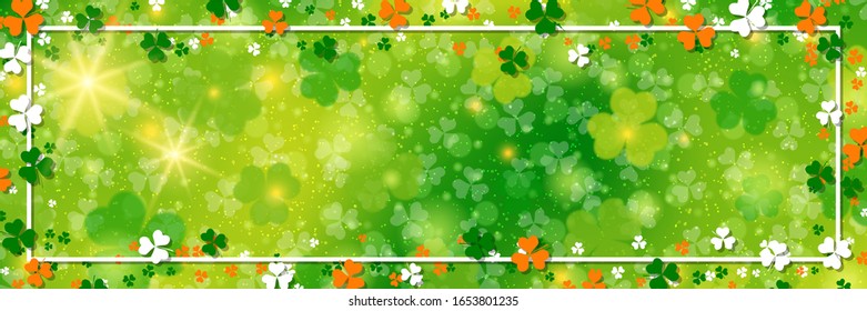St.Patrick's Day vector banner template. Green blurred background with clover leaves and bokeh effect