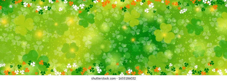 St.Patrick's Day vector banner template. Green blurred background with clover leaves and bokeh effect