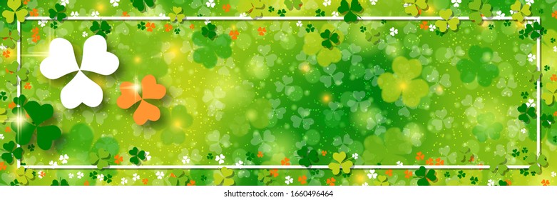St.Patrick's Day vector banner template. Green blurred background with clover leaves and bokeh effect