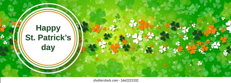 St.Patrick's Day vector banner template. Green blurred background with clover leaves and bokeh effect