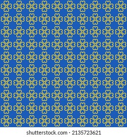 St.Patrick's Day. Yellow clover leaves on blue background pattern. Yellow heart shape pattern on blue backdrop.